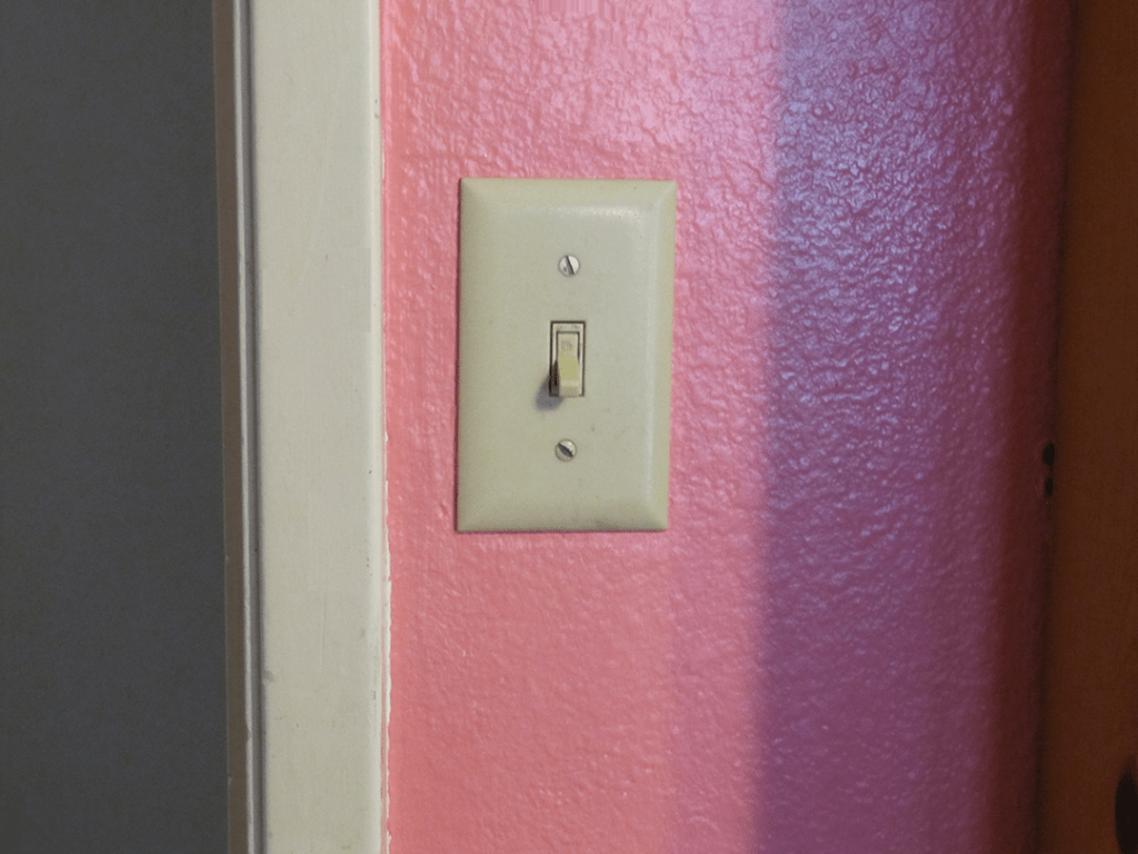It's not hard to replace a standard light switch like this one.