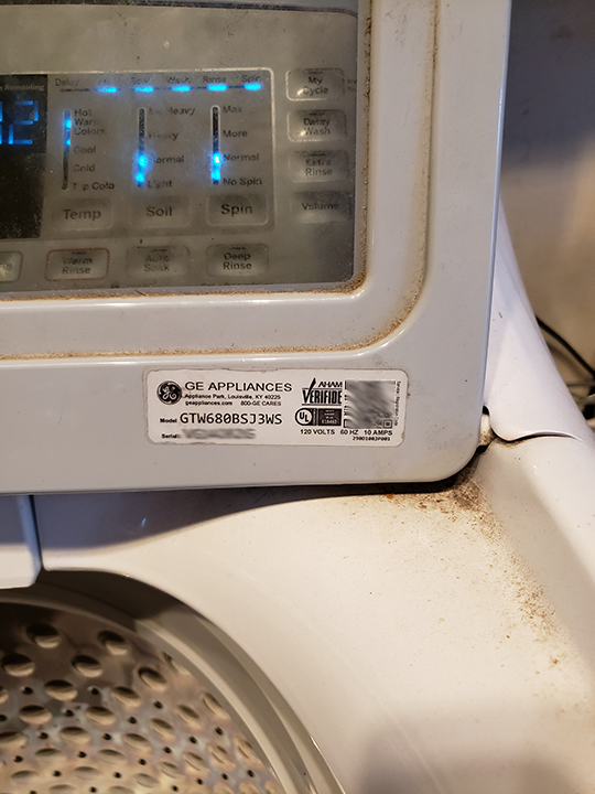 Open the lid of your GE washer to find the tag that gives you the model and serial numbers, plus a QR code that takes right to GE.