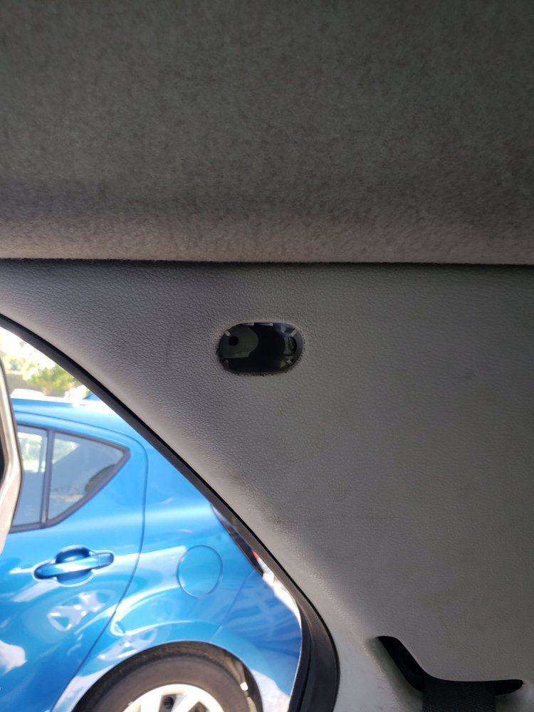 Remove the plastic plug in the middle of the panel.